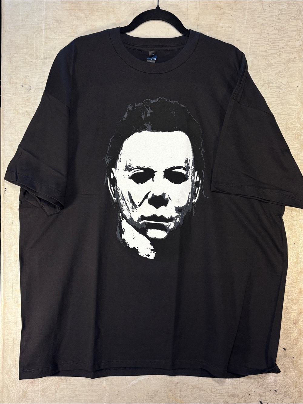 Men's Black Short-Sleeve Graphic Tee with White Face Print